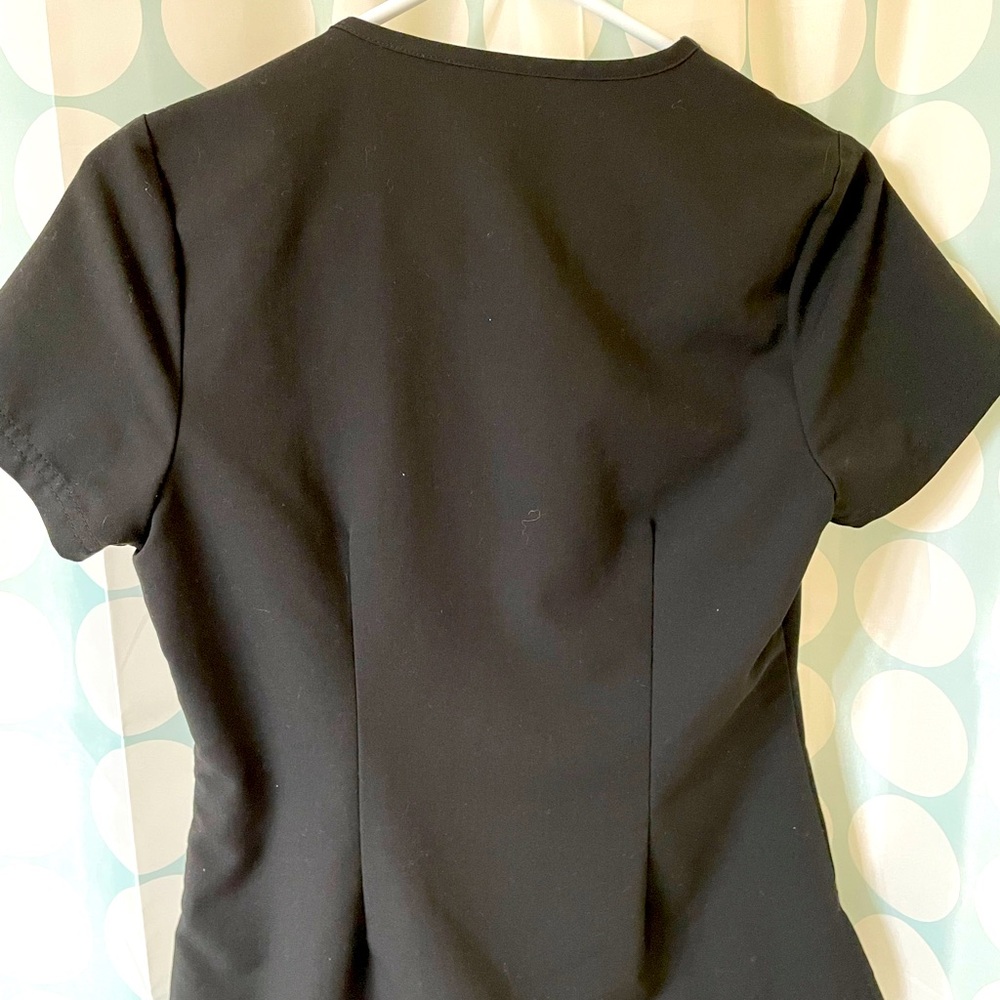 Jaanuu x small 1 pocket tuck on top